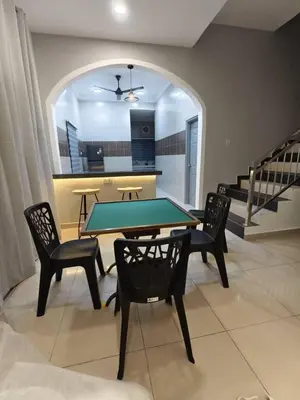 a dining room with a ping pong table and chairs at Hello Pangkor Home 77 - A Nest for 15 buddies in Pangkor