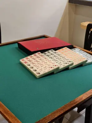 two remote controls sitting on top of a table at Hello Pangkor Home 77 - A Nest for 15 buddies in Pangkor