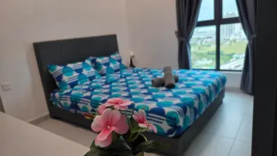 a teddy bear sitting on a bed in a bedroom at NEW Bt Kawan8 3BR Suite-IKEA-UOW-KDU-ColumbiaAsia in Simpang Ampat
