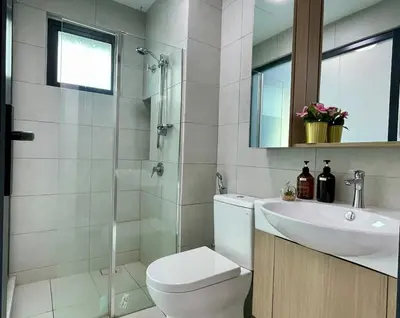 a bathroom with a toilet and a sink and a shower at NEW Bt Kawan8 3BR Suite-IKEA-UOW-KDU-ColumbiaAsia in Simpang Ampat
