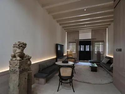 a living room with a couch and a table at Soori Penang in George Town