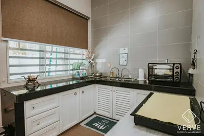 a kitchen with a sink and a microwave at Ipoh Gateway by Verve 4R4B - 14 Pax in Ipoh