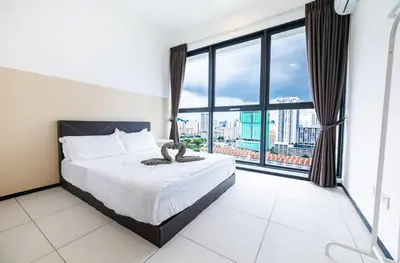 a bedroom with a bed and a large window at Urban Suites Jelutong Georgetown Penang 6pax 3BR Family Cozy Homestay in George Town