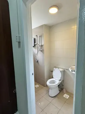 a bathroom with a toilet and a sink at Ayaan Quintet Evergreen with FIFA & Private Parking in Tanah Rata