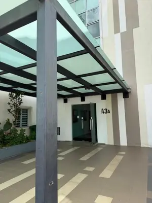 a metal pole in front of a building at Ayaan Quintet Evergreen with FIFA & Private Parking in Tanah Rata