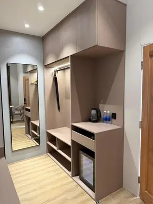 a walk in closet with a mirror and a kitchen at Tambuna Retreat ,TAMBUN ,IPOH in Tambun