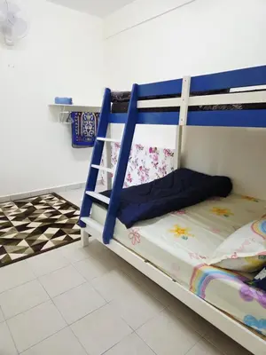a bunk bed with blue and white railings in a room at QaiDaff Homestay CH in Cameron Highlands