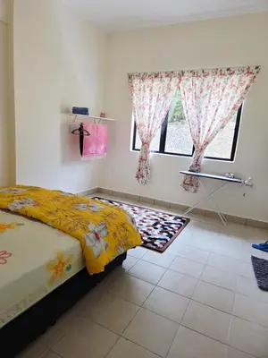 a bedroom with a bed and a window at QaiDaff Homestay CH in Cameron Highlands