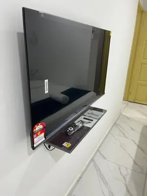 a flat screen tv hanging on a wall at Rest N Go CM in Ipoh