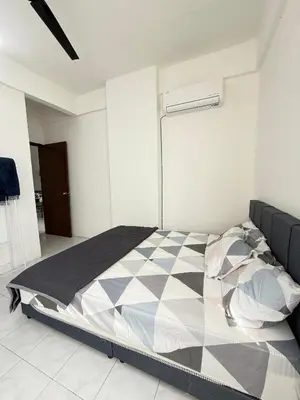 a bedroom with a large bed in a room at SZ Homestay Near KPJ Hospital in Kampong Permatang Batu