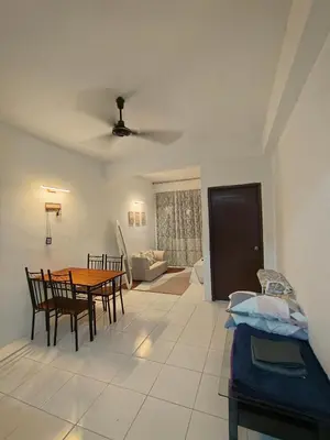 a living room with a table and chairs and a couch at SZ Homestay Near KPJ Hospital in Kampong Permatang Batu