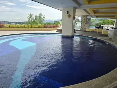 a swimming pool with blue water in a house at The Majestic Privilege Suites - Ipoh in Ipoh