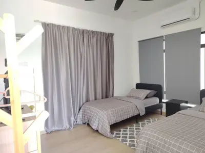 a small bedroom with a bed and a window at Desa Damai Homestay in Penaga