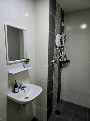 a bathroom with a sink and a mirror at c06 The Anderson Ipoh Family Stay 2BR in Ipoh