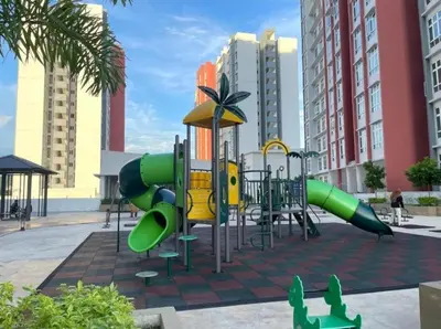 a playground with green and yellow slides in a city at d10 The Anderson Ipoh Family Stay 2BR in Ipoh