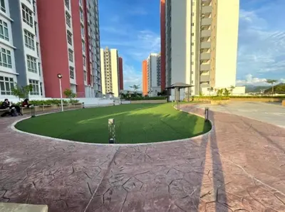 a grassy area in a city with tall buildings at d10 The Anderson Ipoh Family Stay 2BR in Ipoh