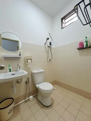 a bathroom with a toilet and a sink at BM Alma Aeonjusco Auto City Homestay in Bukit Mertajam