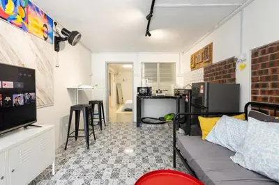 a living room with a couch and a tv at Casa Celia - Pet allowed private parking studio in Ipoh