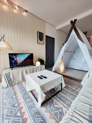 a living room with a bed and a tent at Cameron Highland 915 Glamping Style 3BR 10 Pax in Brinchang