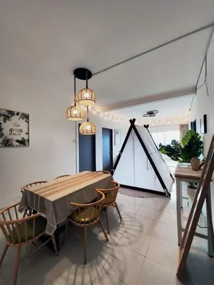 a dining room with a table and chairs at Cameron Highland 915 Glamping Style 3BR 10 Pax in Brinchang