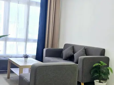 a living room with a couch and a table at a06 The Anderson Ipoh Family Stay 2BR in Ipoh