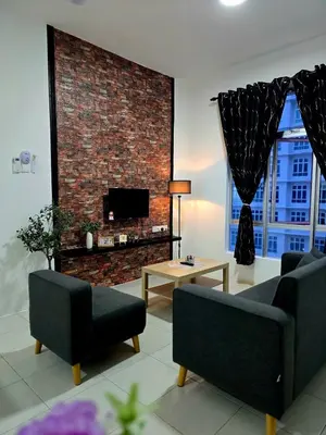 a living room with two couches and a brick fireplace at d01 The Anderson Ipoh Family Stay 2BR in Ipoh