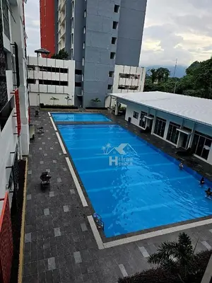 a large blue swimming pool in front of a building at b06 The Anderson Ipoh Family Stay 2BR in Ipoh