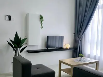 a living room with a tv and a table at a04 The Anderson Ipoh Family Stay 2BR in Ipoh