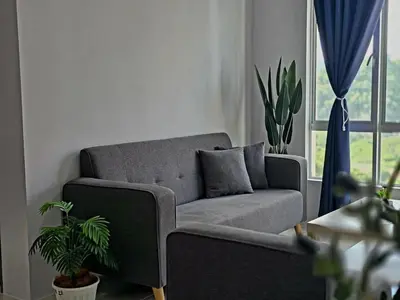 a living room with a couch and a window at b02 The Anderson Ipoh Family Stay 2BR in Ipoh