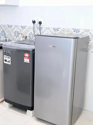 two refrigerators sitting next to each other in a kitchen at d09 The Anderson Ipoh Family Stay 2BR in Ipoh