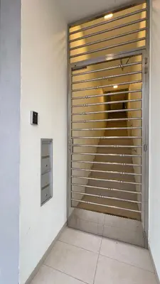 a room with a large garage door with a window at Ether 665 Homestay in Sekincan