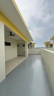 a balcony of a house with a ceiling fan at Ether 665 Homestay in Sekincan