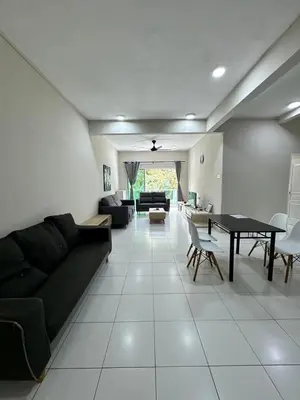 a living room with a couch and a table at AYAAN SOCCER HOME at Quintet Apartment with Free Parking in Tanah Rata