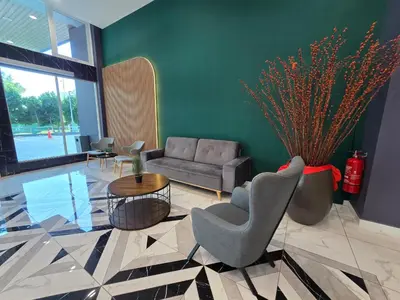 a living room with a couch and a table at ICC Premium Executive Suite - Ipoh in Ipoh