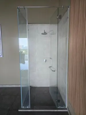 a shower with a glass door in a bathroom at ICC Ipoh Bond Suites by Merveille Louise in Ipoh