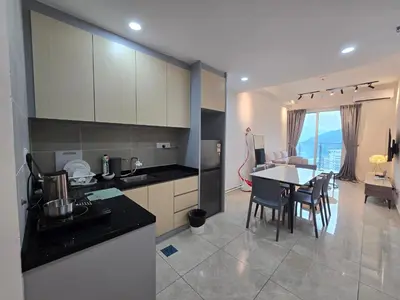 a kitchen and dining room with a table and chairs at ICC Ipoh Bond Suites by Merveille Louise in Ipoh