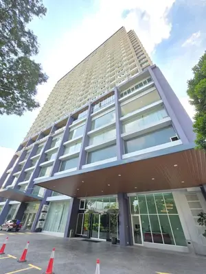 a building with orange cones in front of it at ICC Ipoh Bond Suites by Merveille Louise in Ipoh