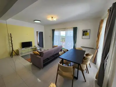 a living room with a couch and a table at Cameron Highland 910 The Garden 3BR 6 Pax in Brinchang