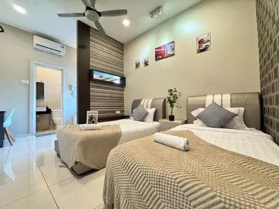 a bedroom with two beds and a bathroom at Botani Pool Villa 5R4B 14pax Karaoke BBq in Ipoh