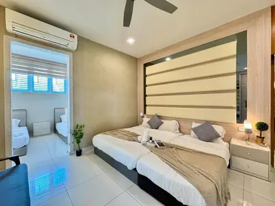 a bedroom with a large bed and a window at Botani Pool Villa 5R4B 14pax Karaoke BBq in Ipoh