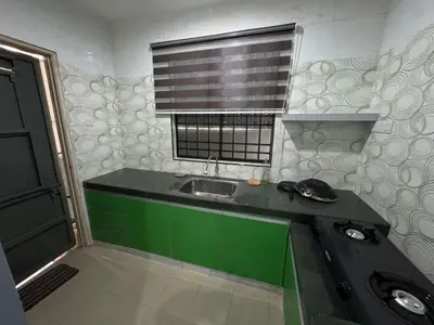 a small kitchen with a sink and a window at Teratak Perdana in Sungai Petani