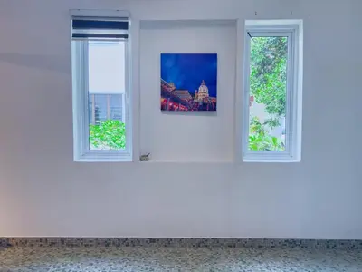 two windows in a white room with a picture on the wall at Tanjung Bungah Holiday Home 4BR 20Pax 6Carpark in Tanjung Bungah