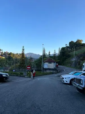 a person standing in the middle of a road at Cameronian Lodge by AziziCameron in Tanah Rata