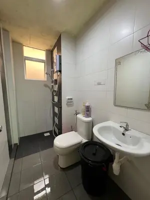 a bathroom with a toilet and a sink at Cameronian Lodge by AziziCameron in Tanah Rata
