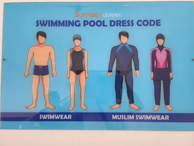 a group of men wearing swimsuits and swimmingpool dress codes at Sunrise Gurney Spacious Comfort Suite - Penang Gurney Drive in George Town