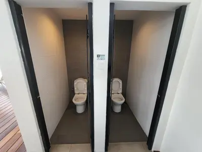 two stalls with two toilets in a bathroom at Sunrise Gurney Spacious Comfort Suite - Penang Gurney Drive in George Town