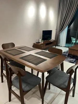 a dining room table with chairs and a television at Sunway Onsen beautiful view 4-6pax in Tambun