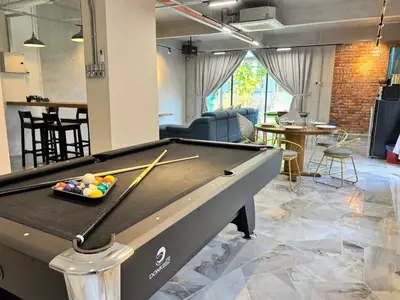 a pool table in the middle of a room at Ruyu 44 TownVilla 5R4B 18pax Bbq KTV Pool Table in Ipoh
