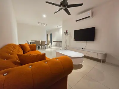 a living room with a couch and a flat screen tv at Manhattan Condo - Ipoh Merveille Luxe Stay in Ipoh