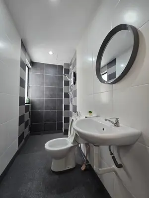 a bathroom with a sink and a toilet and a mirror at Manhattan Condo - Ipoh Merveille Luxe Stay in Ipoh